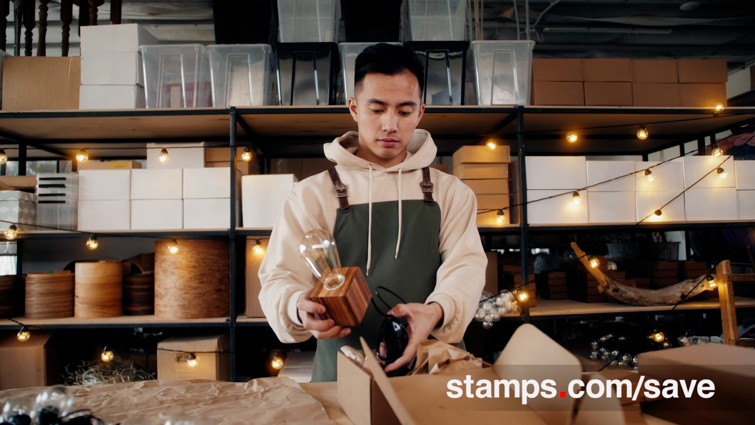 man packs lightbulb for stamps.com
