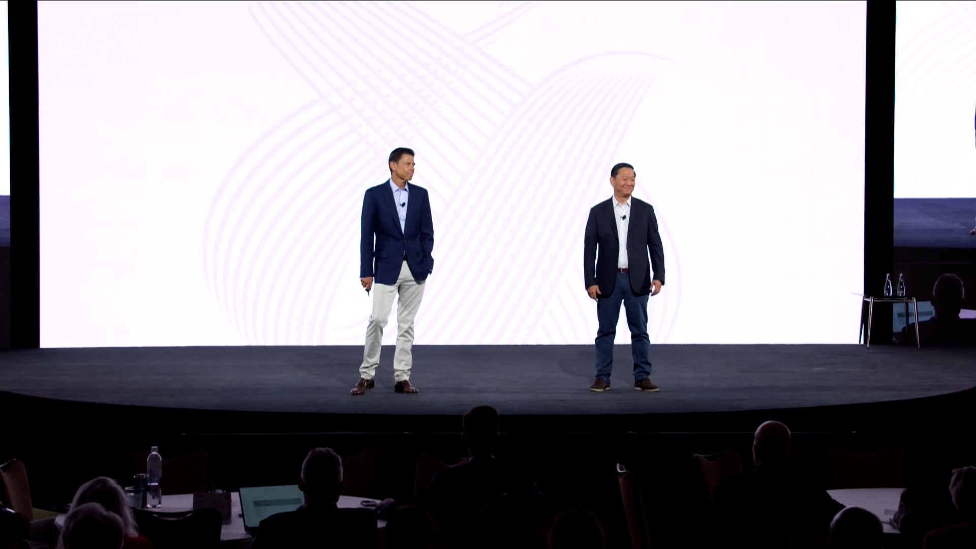 two speakers on stage at kkr global investors meeting